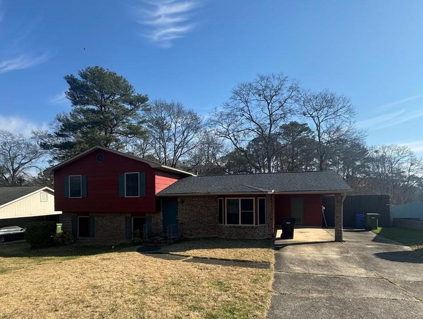 Tri-level home with a front yard