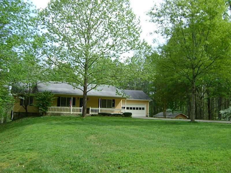 Exterior Front. Ranch home in a beautiful setting.