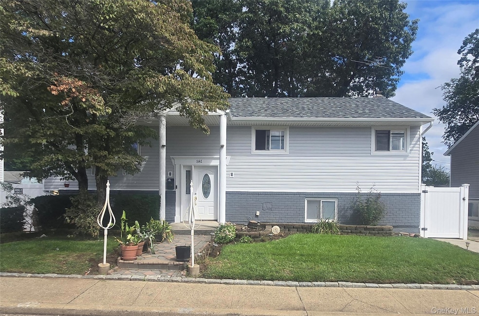 581 Meacham Ave unit 2nd Floor, Elmont, NY 11003 - photo 1