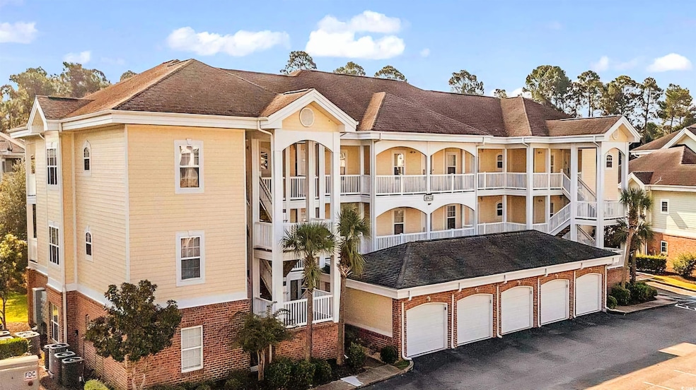 View of property with a garage