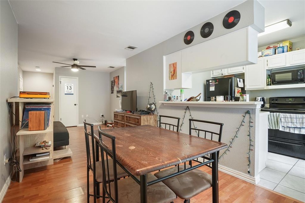 Spacious dinning area looking into the kitchen and