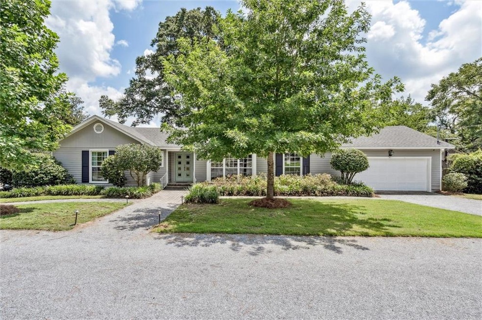 View of front of house featuring a garage and a fr