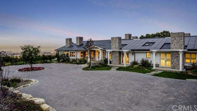 Amazing curb appeal with pavered driveway and spec