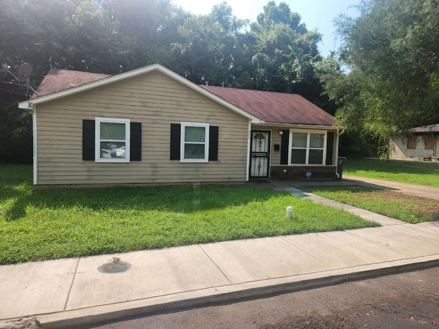 View of front of property with a front yard