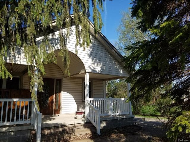 Beautiful full front porch with mature trees!
