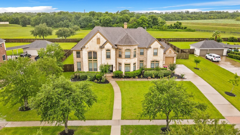 A spacious home with a large front yard and a curv