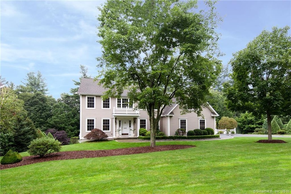 Set on app. 1 acre of lovely grounds, this home sp