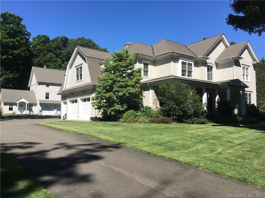 3 car attached garage PLUS a 2 bay barn with offic