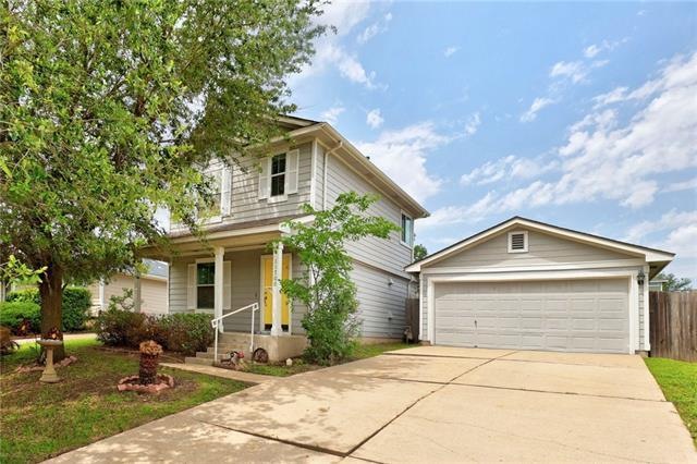 Cottage style 2-story home with a detached 2-car g