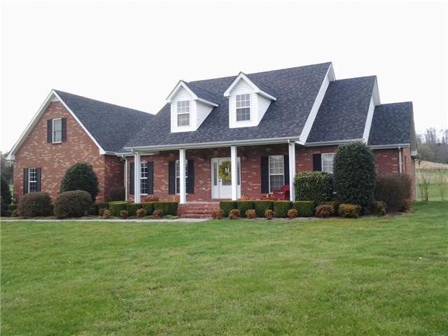 Full brick 9.47 acres. fenced with barn. Bring your horses.
