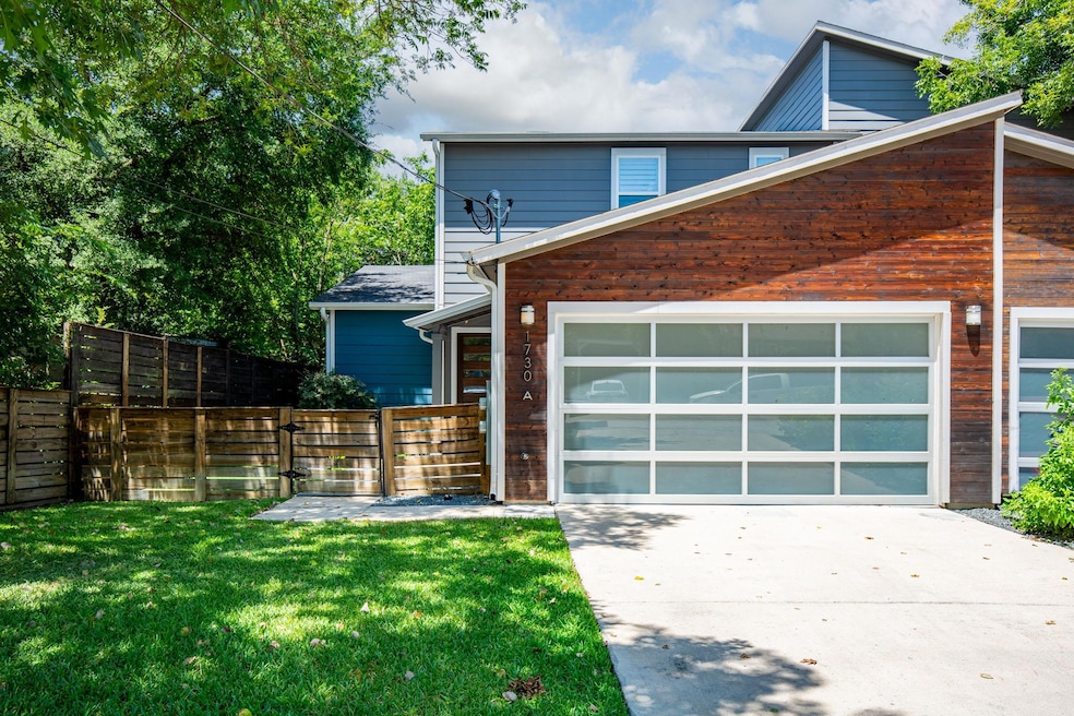 View of front of property featuring concrete driv