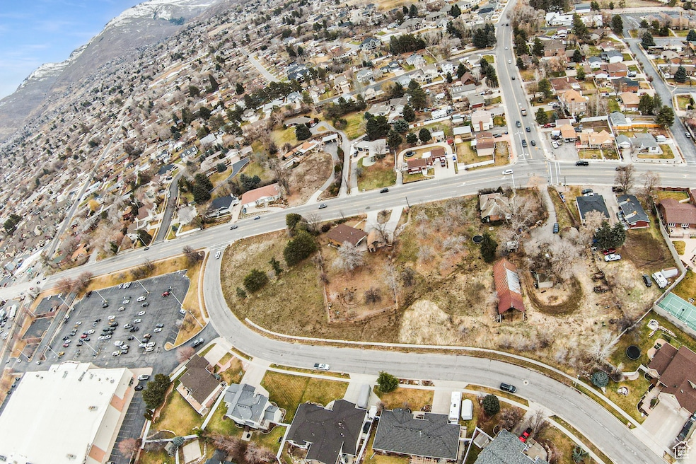 Birds eye view of property with a mountain view