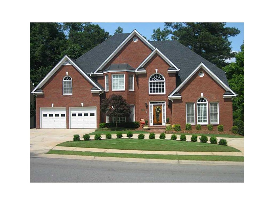 Exterior Front. 3 Sided Brick Exterior with side d