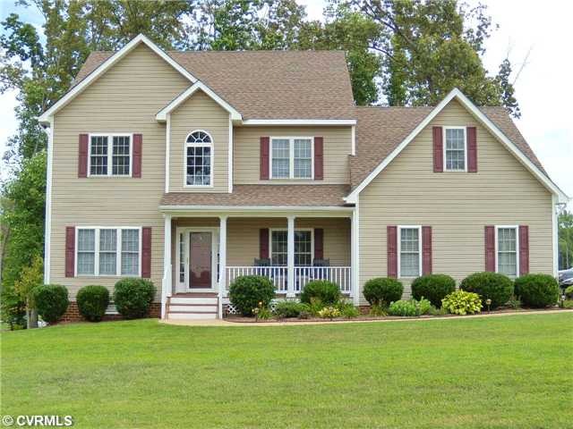 Exterior Front - Front porch, aggregate walkway, m