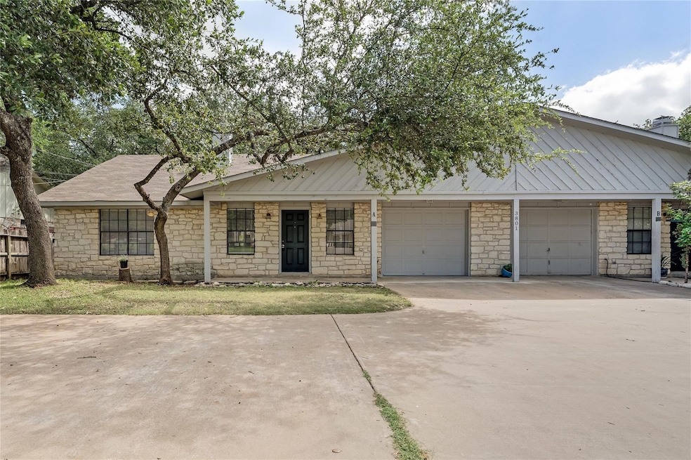 View of front of home with stone siding, concrete