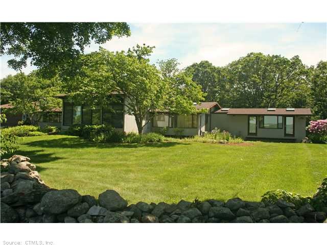 Exterior Front. RAMBLING CONTEMPORARY WITH SOARING