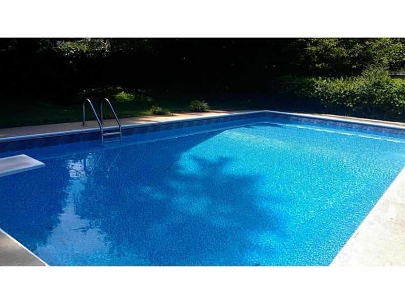 Outdoor pool featuring a diving board When pool is