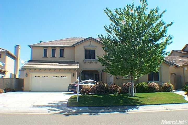Front of home on a beautiful street, near the most
