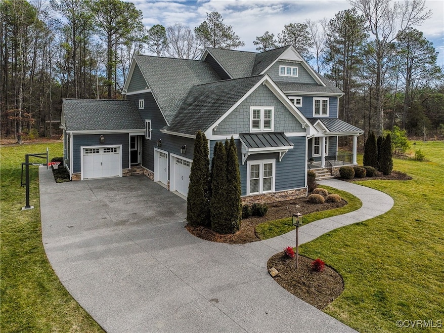 View of home's exterior with a porch and a lawn