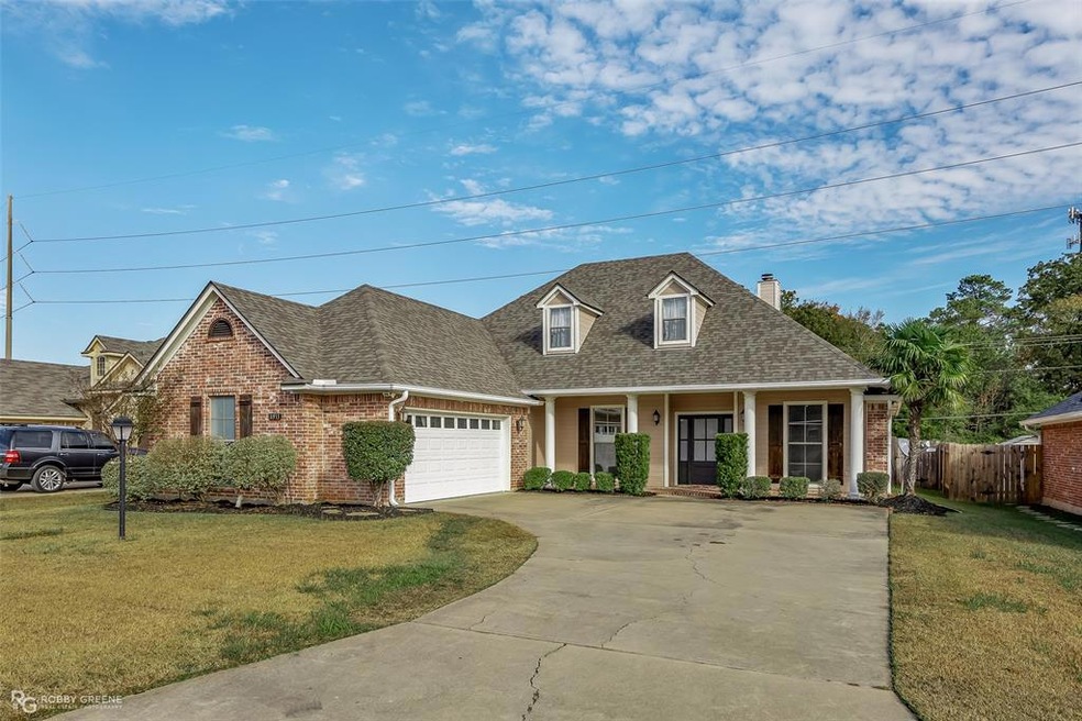 Lovely Front elevation with covered brick front po
