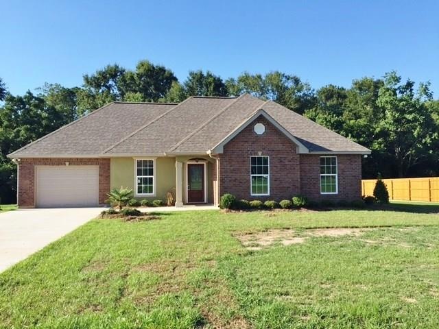 Brick all around this quality constructed home on