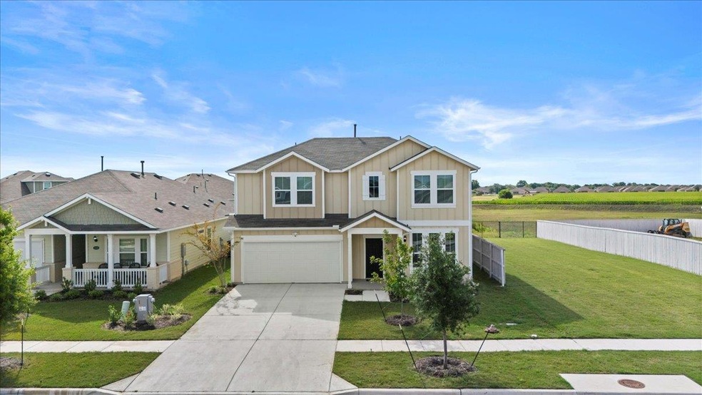 View of front of house featuring concrete drivewa