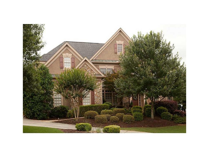 Exterior Front. Hardcoat Stucco with Stone