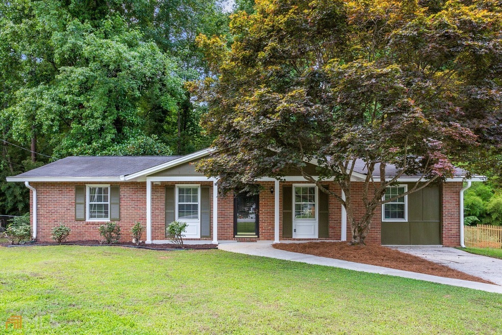 Updated Brick Ranch with Serene Tree-Lined Views!