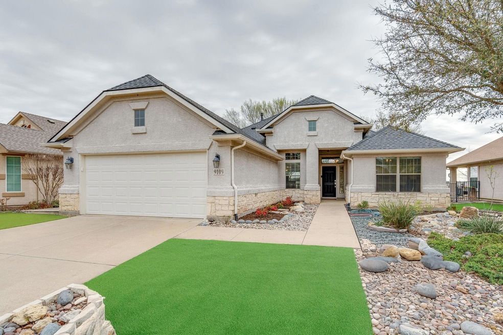 Traditional-style house featuring a shingled roof,