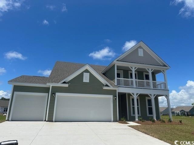 View of front of property with a balcony