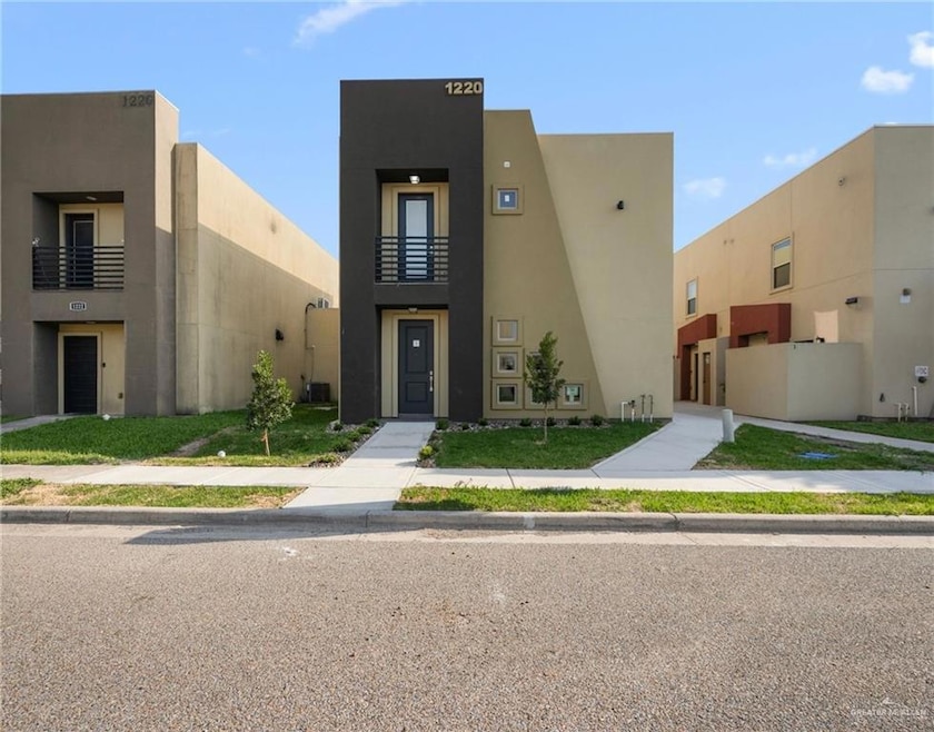 View of front of house featuring stucco siding