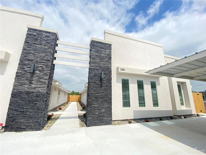 View of side of home with stucco siding