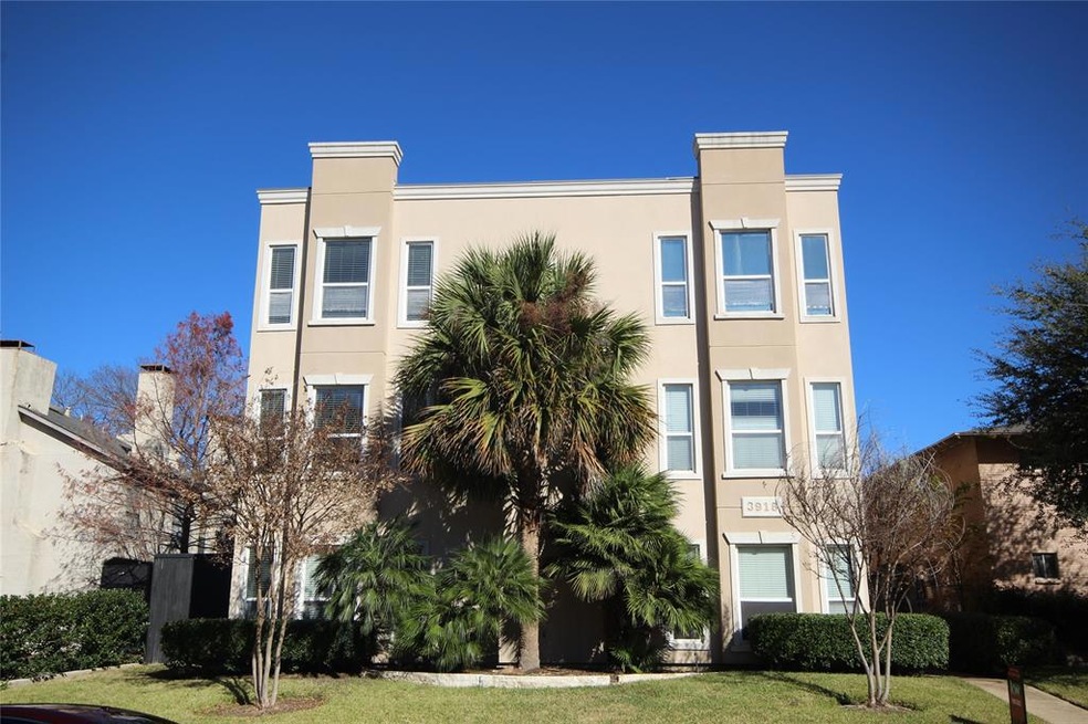Small 12 unit condo building with gated entry and 