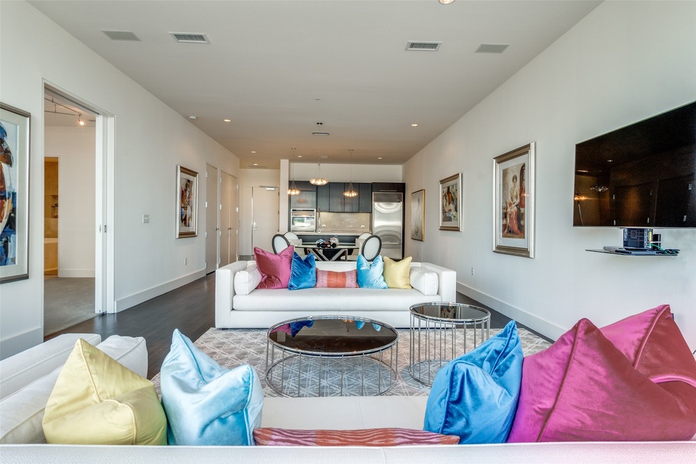 Living area with recessed lighting and wood finished floors
