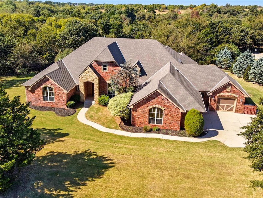 View of front facade with a front lawn and a shingled roof