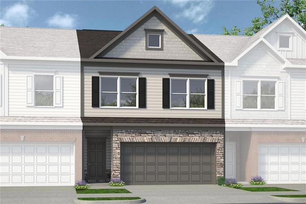 Townhome / multi-family property with stone siding