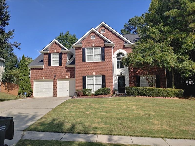 Your new beautiful front side brick home with curb