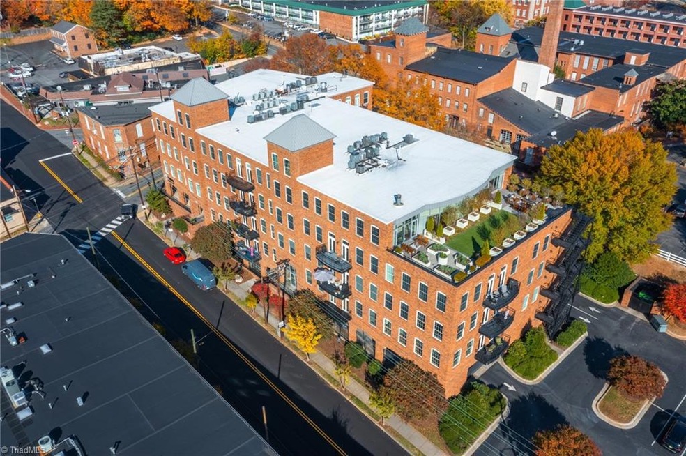 Welcome to Tar Branch Towers at 411 S Marshall St. Unit 206 is the balcony with the blue and white umbrella.