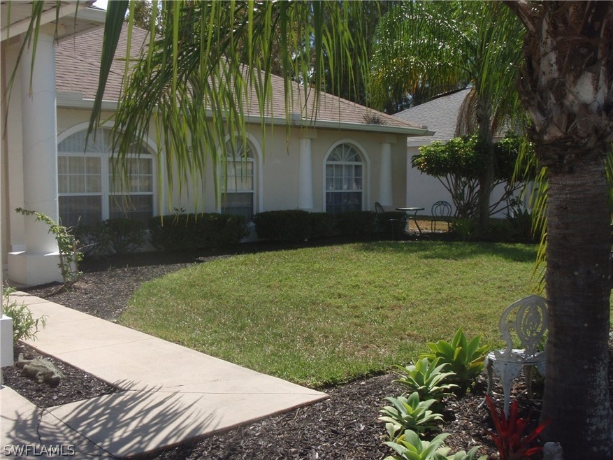 Front of home, walkway from driveway to entry