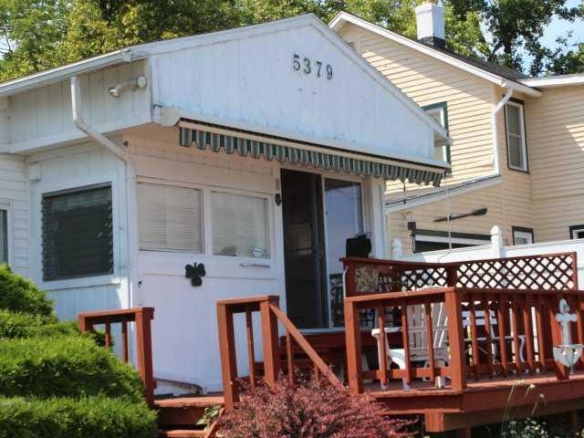 Exterior Front vinyl siding with a cedar deck!