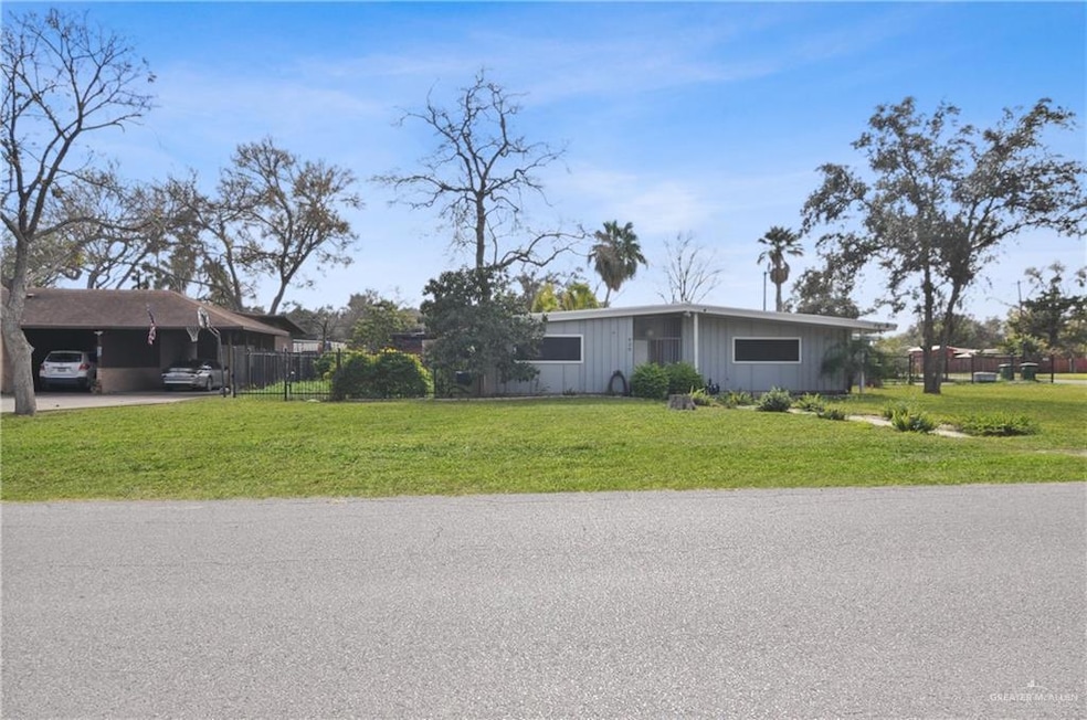 View of front of property featuring a front lawn