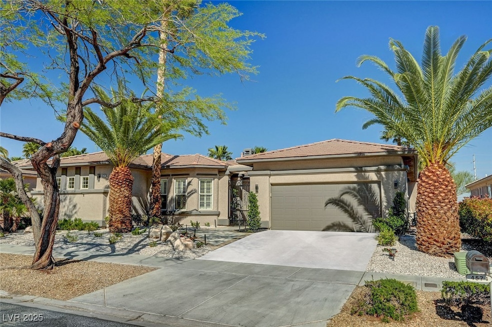 Ranch-style house with an attached garage, stucco