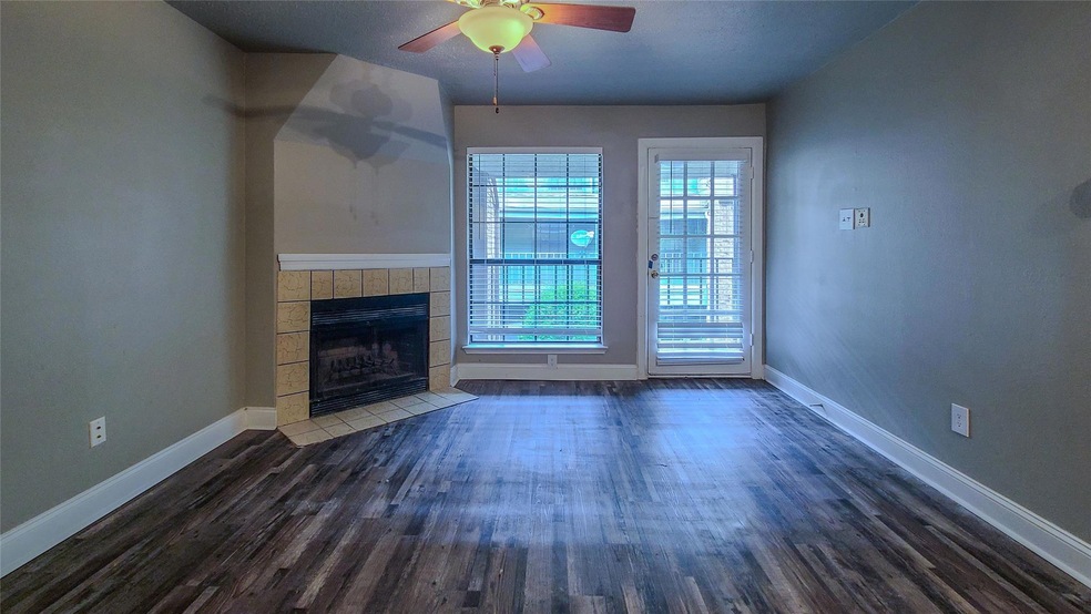 Unfurnished living room with dark hardwood / wood-