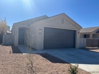 Ranch-style home featuring a garage