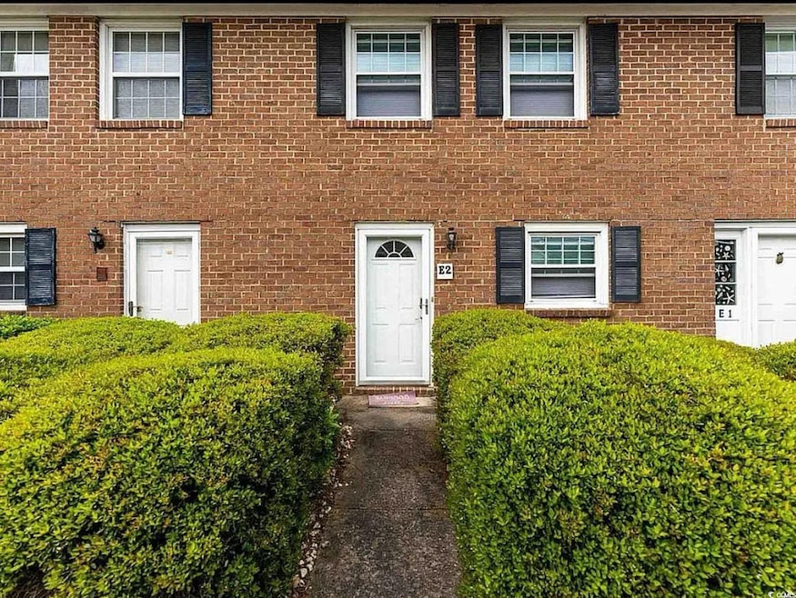 View of front facade featuring brick siding