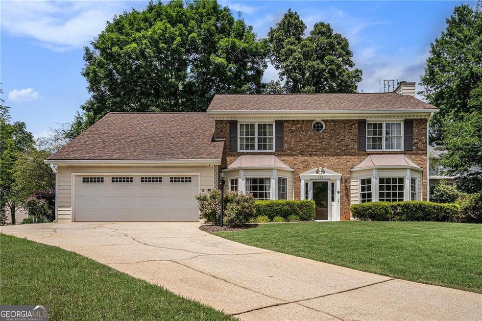 Front of Structure - Colonial home with a chimney,