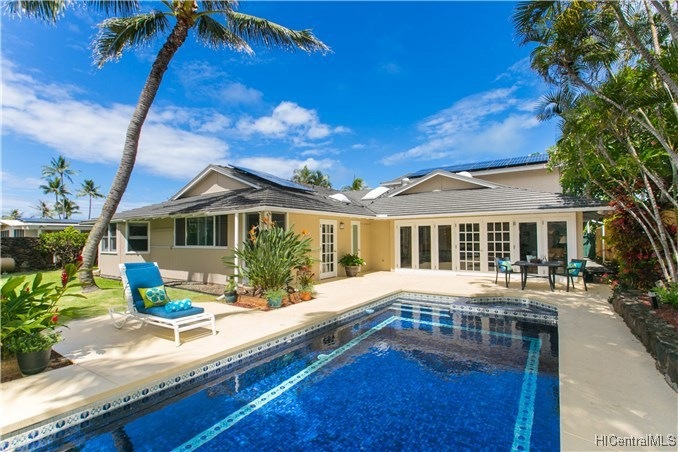 Gorgeous tile pool with attached built-in hot tub.