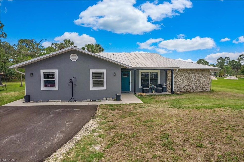 Paved drive leading to home.