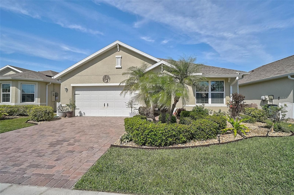 The expansive paved driveway offers ample space for multiple vehicles, providing both convenience and great curb appeal.