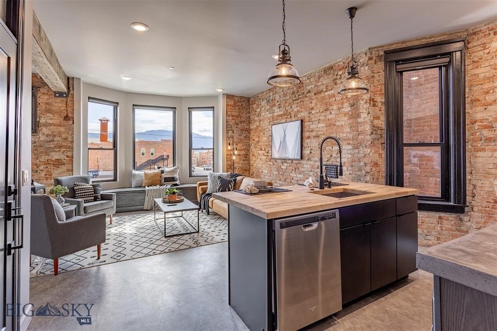 Kitchen featuring butcher block counters, a center